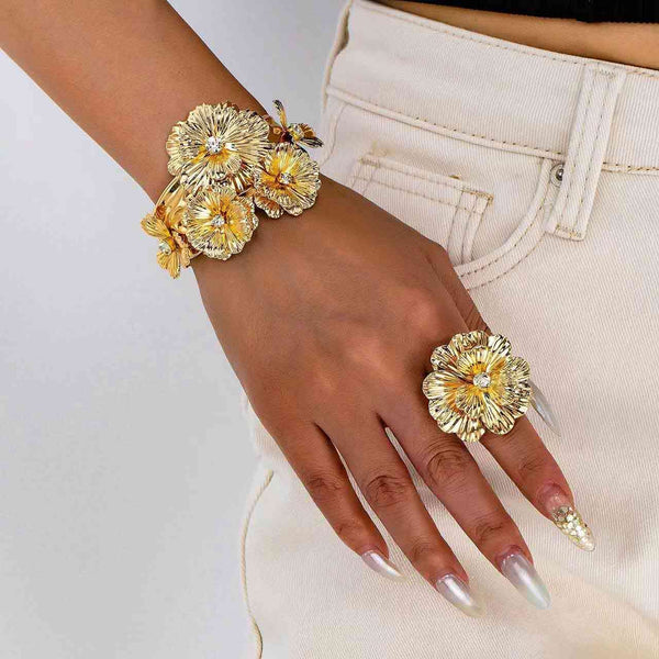 open cuff bracelet and a flower open ring